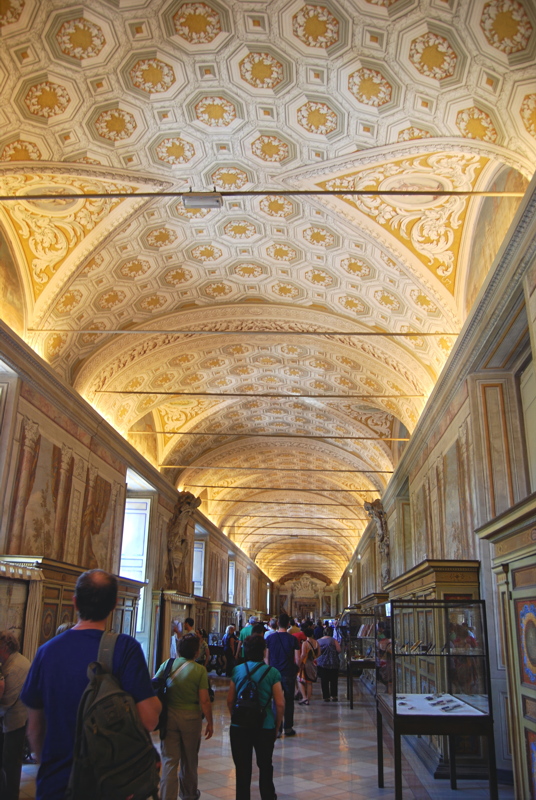 12 - The ornate vaulted ceiling and long gallery hallway of the Vatican Apostolic Library, located within the Vatican Museums in Vatican City